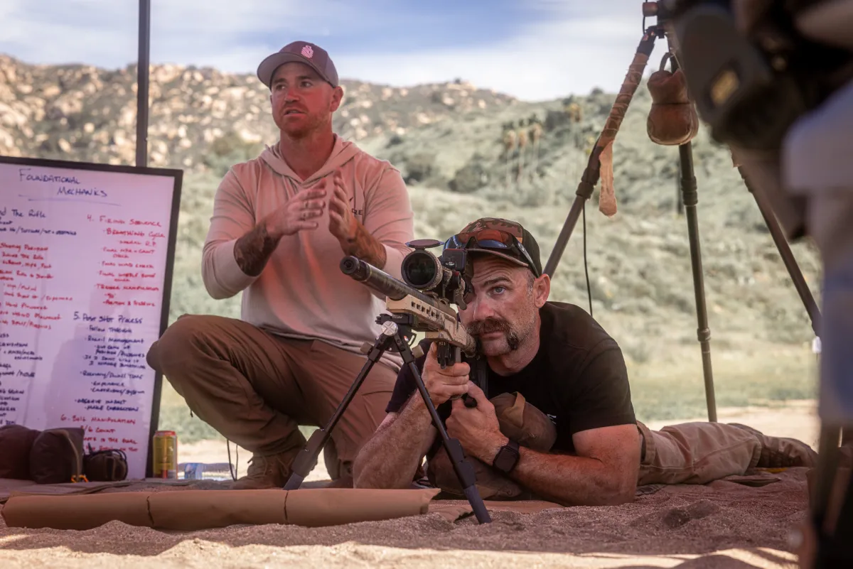 Cadre instructor coaching a precision rifle student