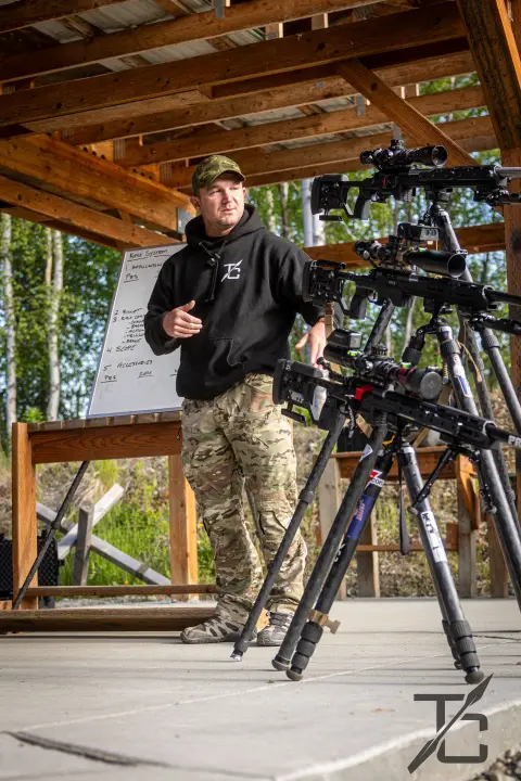 Instructor showing the rifle rack of bolt guns