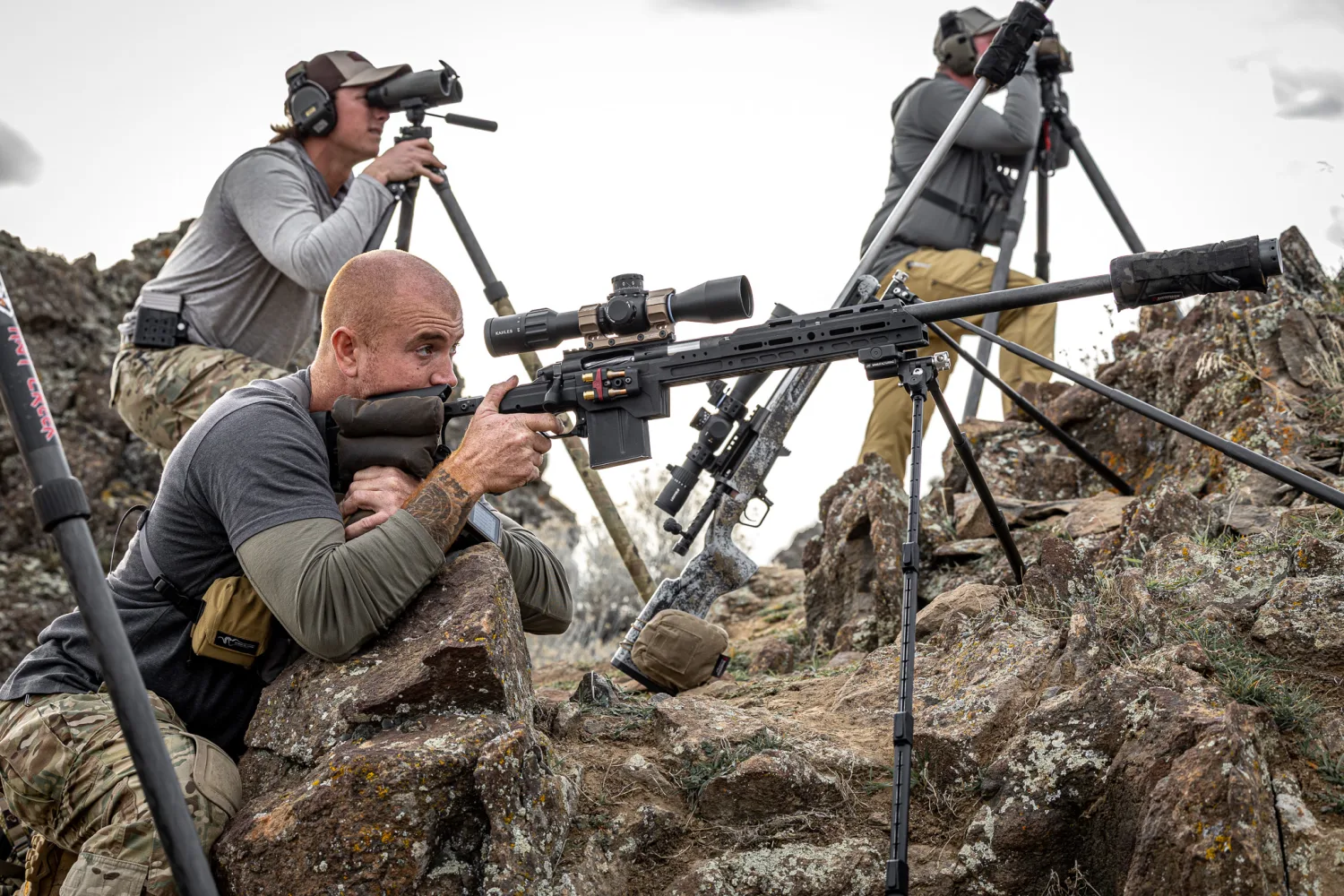 John Bumpus shooting from a rocky position during competition
