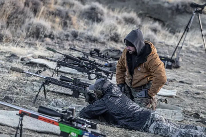 Instructor coaching a prone shooter on the line