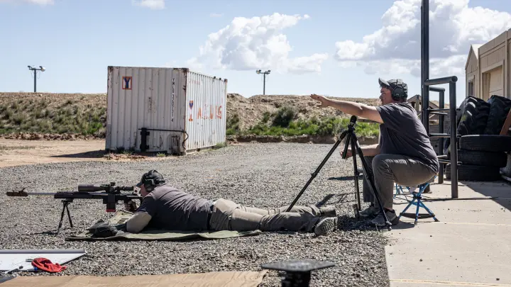 Spotter calling for the prone shooter