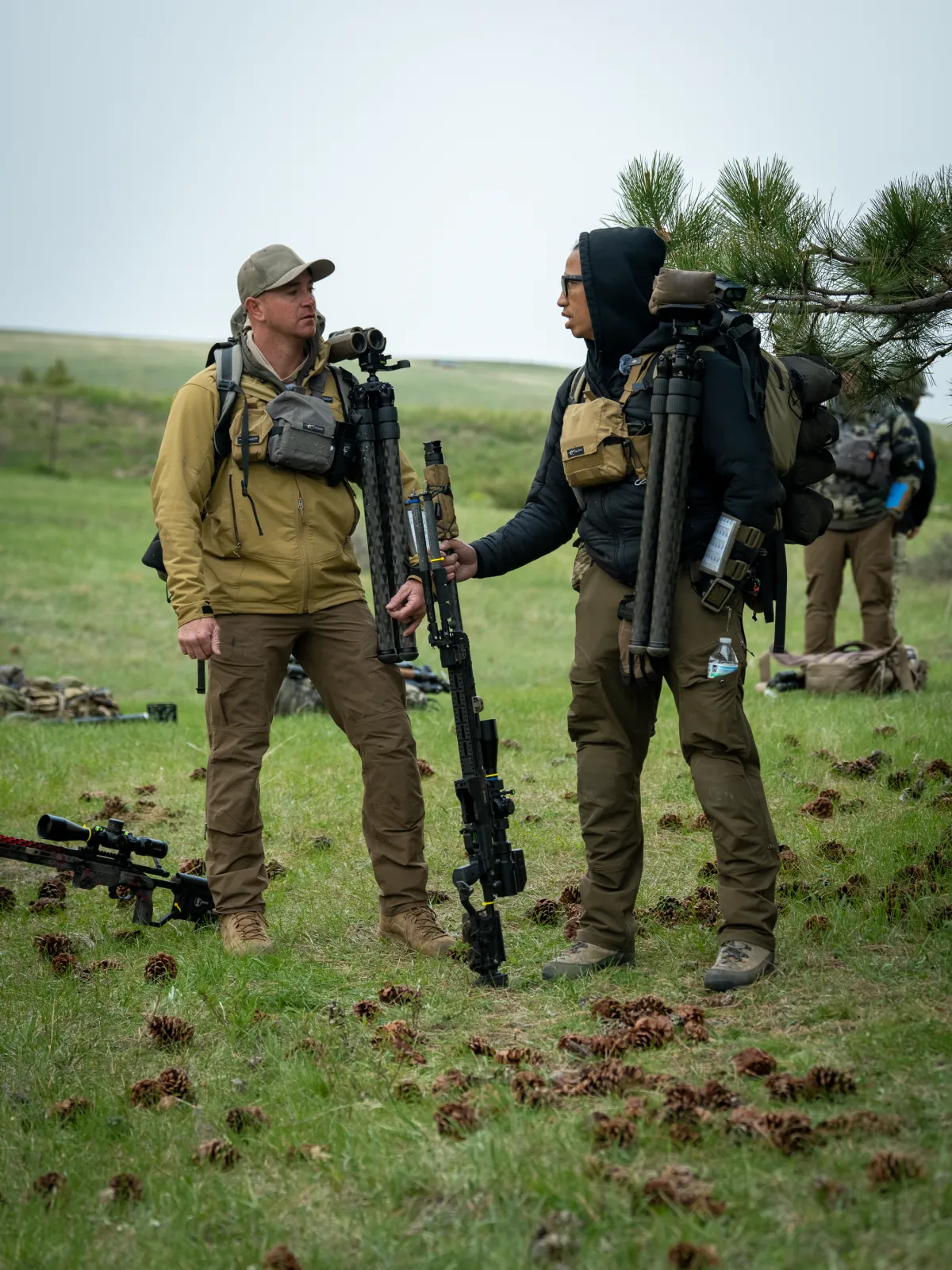 Two Cadre instructors with Really Right Stuff tripods and packs between stages