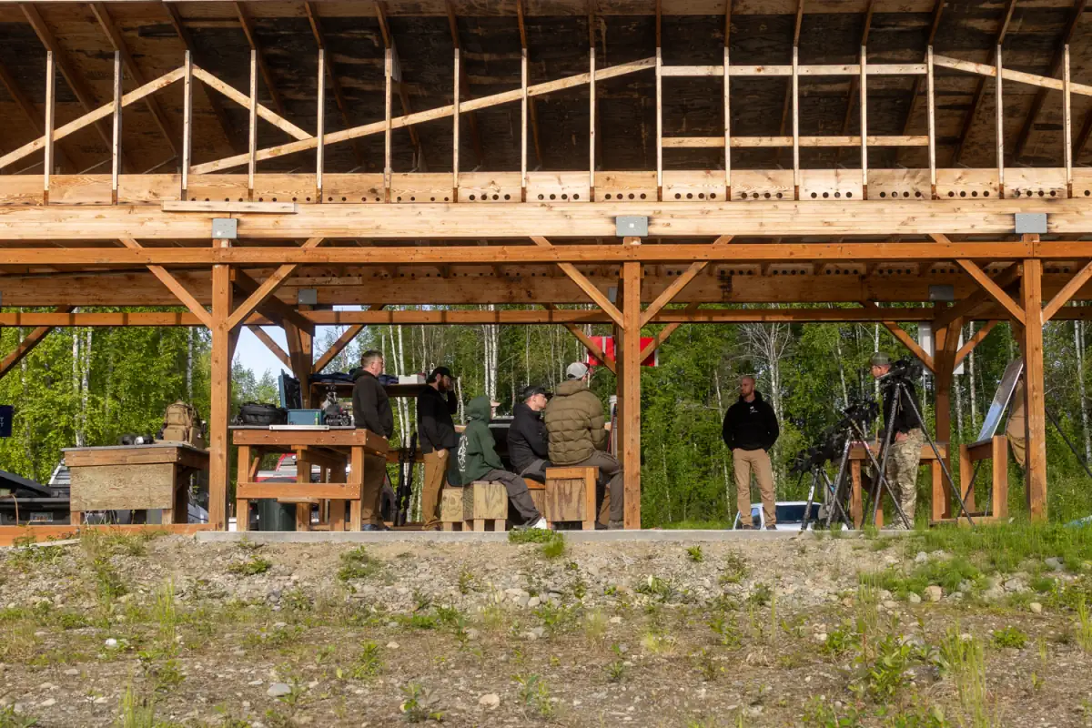 A class at the tables under the range pavilion during an Alaska course