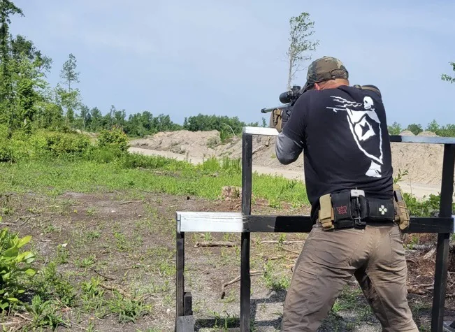 Eric Avvisato shooting a precision rifle off a barricade at a PRS match