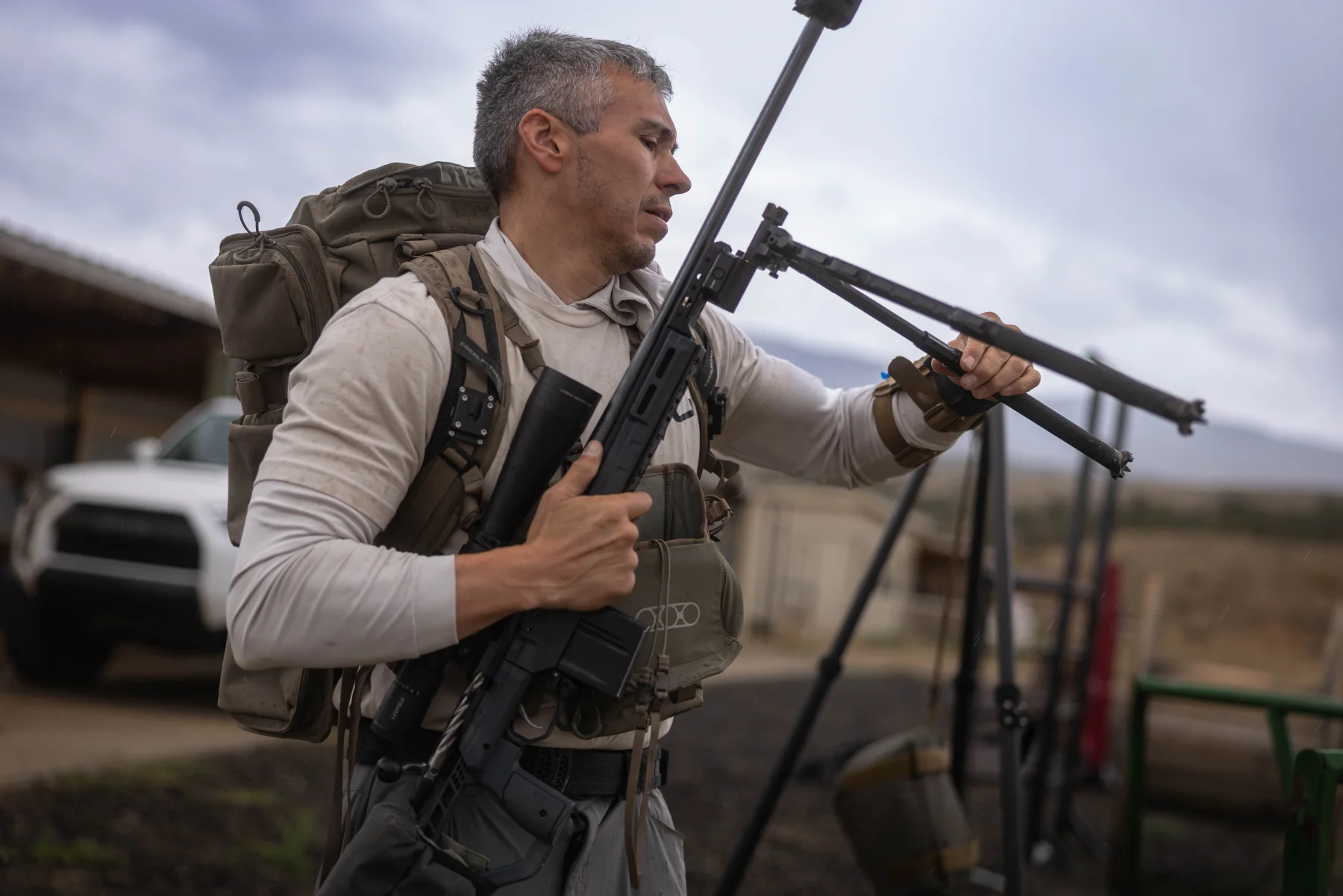 Patrick Trujillo adjusting the bipod on his rifle