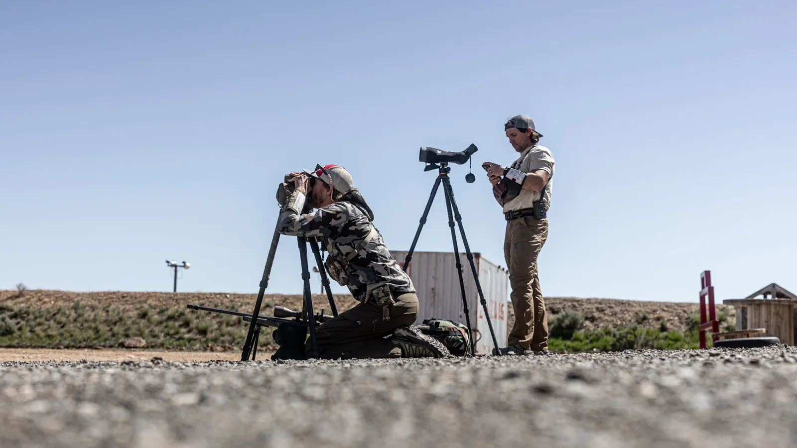 Shooters reading wind across open terrain at an NRL Hunter match in Wyoming.